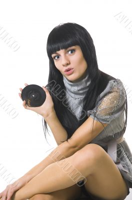 The beautiful brunette with a vinylic plate The beautiful brunette with a vinylic plate