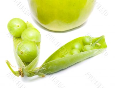 Pods of a green peas, plum and apple