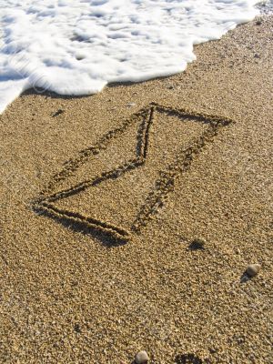 envelope on wet sea sand envelope on wet sea sand