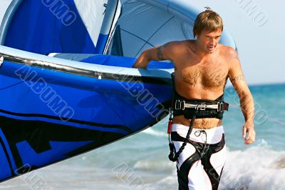 portrait of kitesurfer with kite