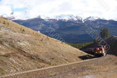 Freight train hauling up the Rocky Mountains