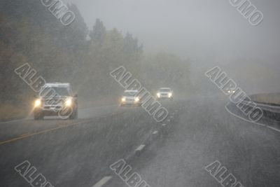 Traffic moving through fog