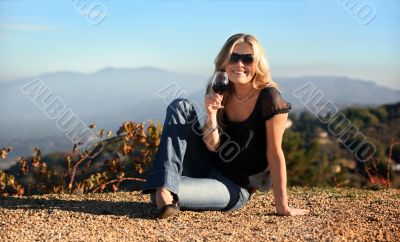 Blond woman with a glass of wine Blond woman with a glass of wine