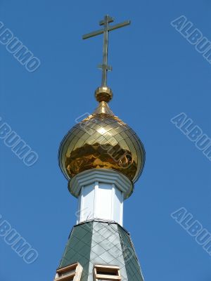 Church Cupola with Holy Cross upon blue sky