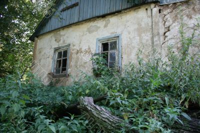 Two alone aged ruined windows of hut