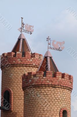 Castle Towers with Feathers Upon Blue Sky