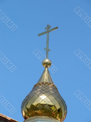 Church Cupola with Holy Cross upon blue sky