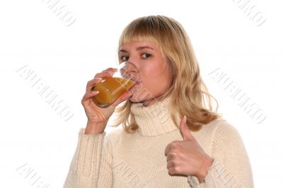Smiling girl is drinking juice and good idea gesture