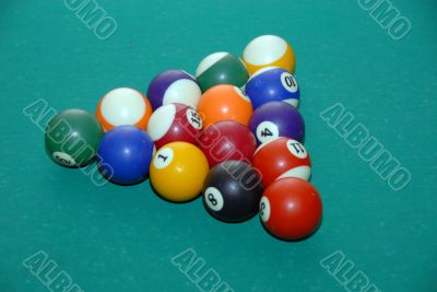 billiards table with pool balls