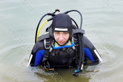 scuba diver entering the water