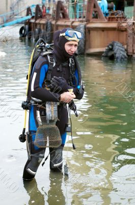 scuba diver entering the water