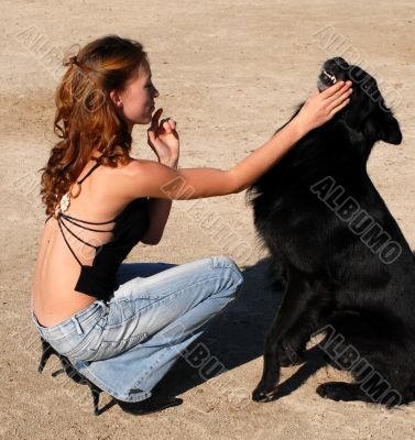 girl and black dog