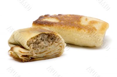 pancake with meat on white