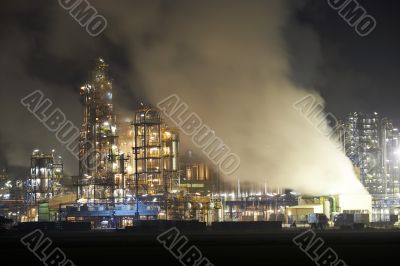 Oil factory with cloudscape