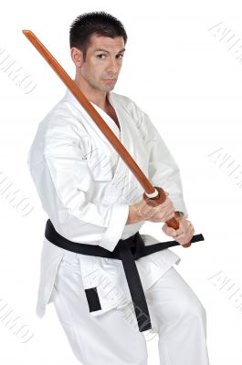 karate expert with wooden sword