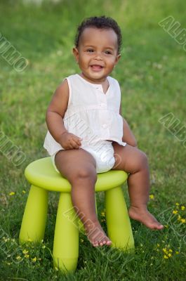 Toddler playing with chair