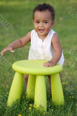 Toddler playing with chair