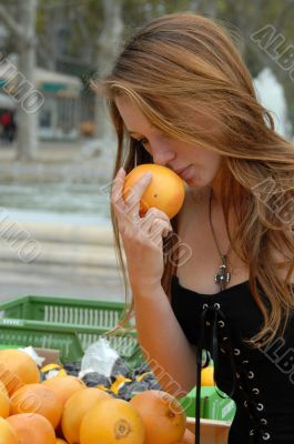 young woman smell a fruit