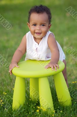  Toddler playing with chair