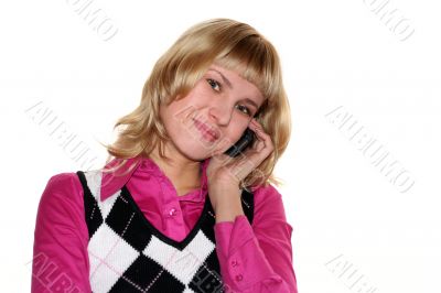 Young blond woman is calling by mobile phone