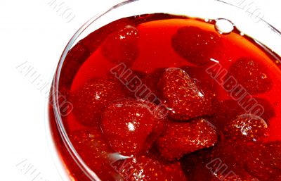 Strawberry jam in transparent glass