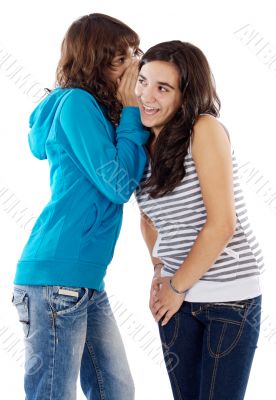 Teenager girls whispering a secret