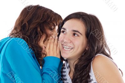 Teenager girls whispering a secret
