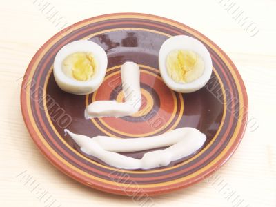 side plate, egg  and mayonnaise on table