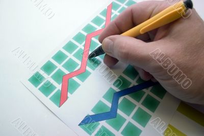 hand with pen on a diagram hand with pen on a diagram
