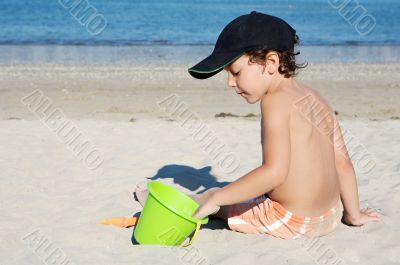 boy playing in the beach