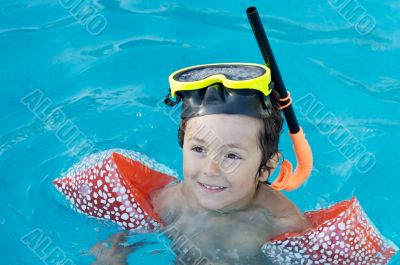 boy learning to swim