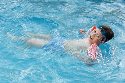 boy learning to swim