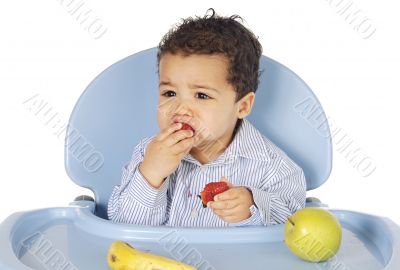 adorable baby eating fruit
