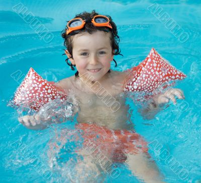 boy learning to swim