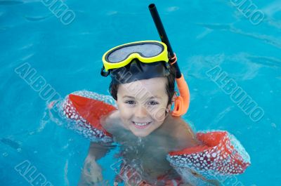 boy learning to swim