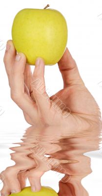 Apple in a hand reflection