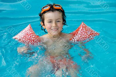 boy learning to swim