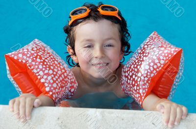 boy learning to swim