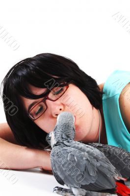 red tale parrot isolated on white kissing with female