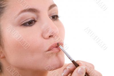 Applying lipstick Applying lipstick