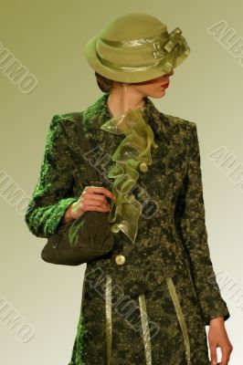 Green coat and a hat