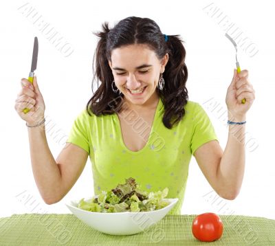 adolescent eating a salad