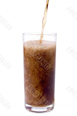 Pouring cola in to the glass