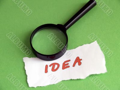 Idea, magnifier on green Idea, magnifier on green