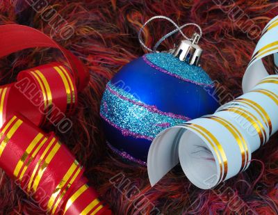 Christmas blue ball and ribbons on fluffy background