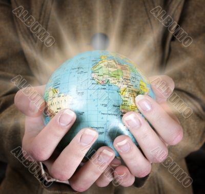 Globe in a girl`s hands