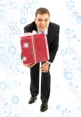 businessman with pink gift package and snowflakes