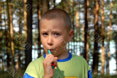 boy is brushing his teeth