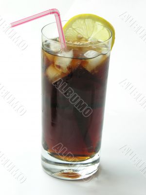 brown cooling drink with ice and lemon slices