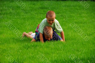 boys play on the grass